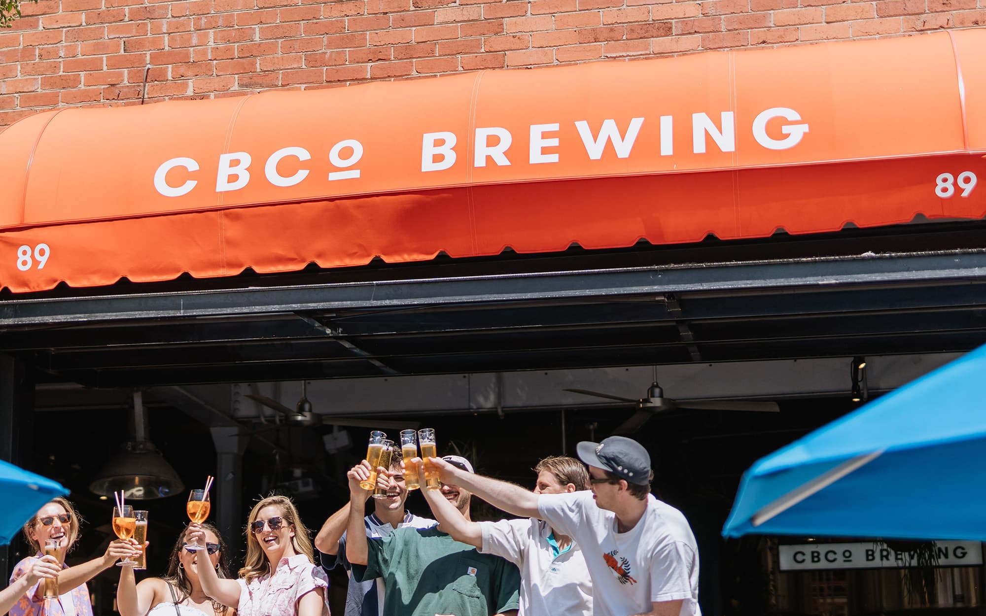 photo of awning with people drinking CBCo under it