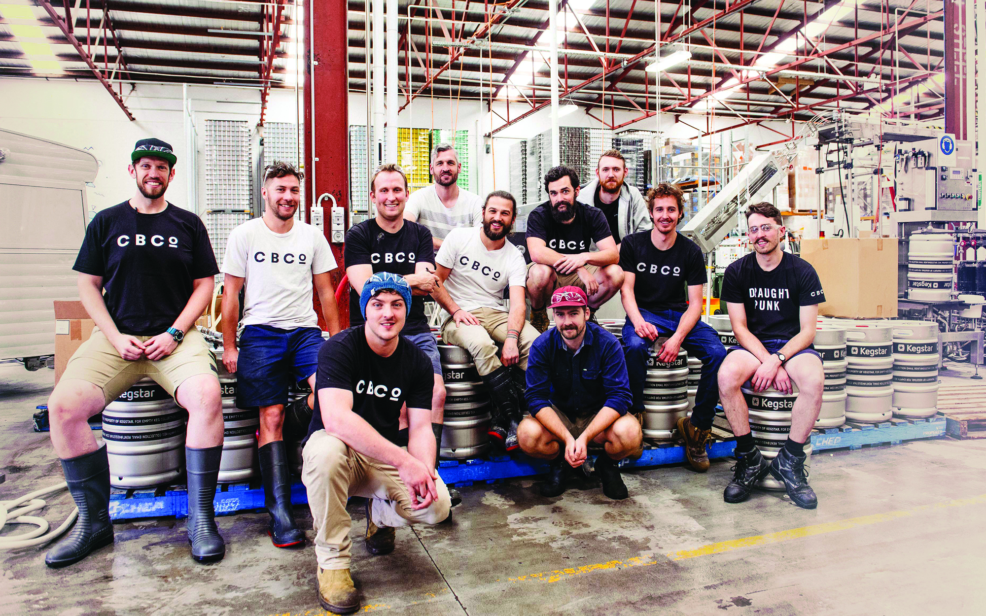 CBCo brewers smiling at camera